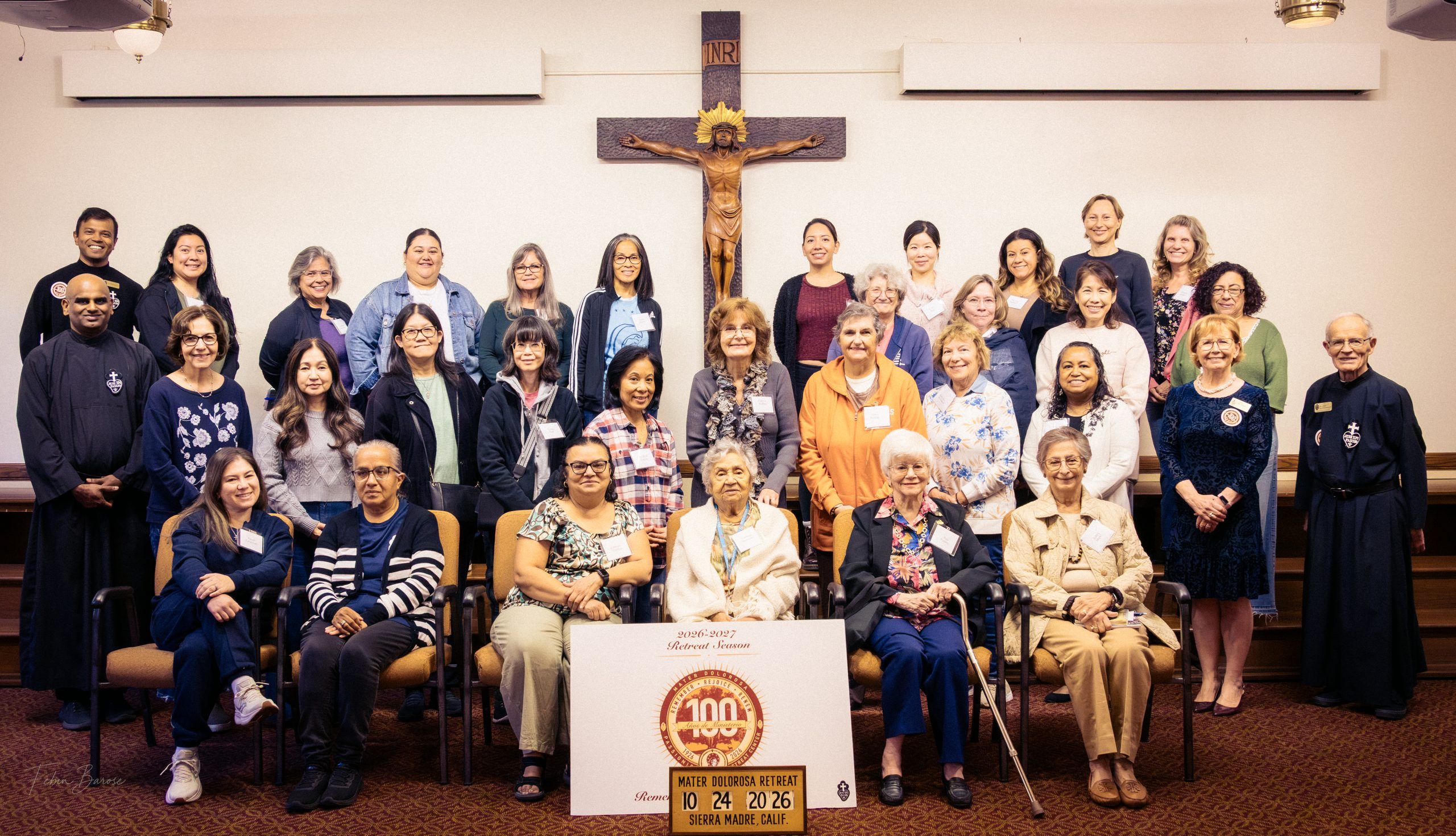 Group of women in the chapel at Mater Dolorosa Passionist Retreat Center after a weekend retreat with a crucifix in the background